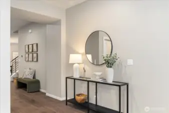 Experience a seamless transition into the home where premium hardwoods and a designer-curated palette flow consistently across both levels. No carpet in the home!