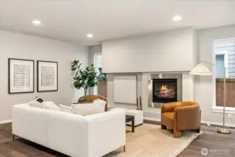 A study in modern architecture, this great room pairs clean lines with inviting warmth, centered around a sleek gas fireplace.