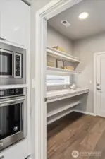 The Butler’s Pantry: Walkthrough layout strategically designed for a streamlined lifestyle.