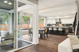 Seamless indoor outdoor connection extends the living space, with a designated dining area and open kitchen designed for both everyday living and easy entertaining.