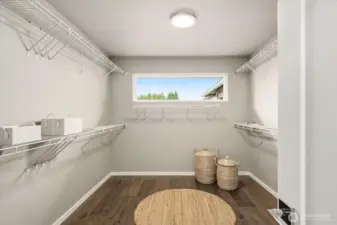 Primary Wardrobe: Expansive, light-filled walk-in designed for an elevated dressing experience. This room is a wow!