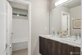 A spacious dual vanity bathroom with premium finishes.