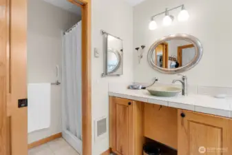 Primary bathroom area with full soaking tub