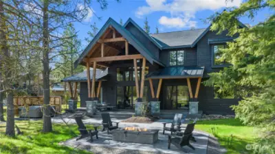 Great shot showing additional hardscaping ,to beautifully tie in the firepit and hot tub with patio for that lovely outdoor dining environment everyone loves across Suncadia and Tumble Creek