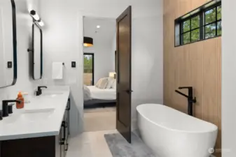 Primary suite bath with soaking tub and oversized shower
