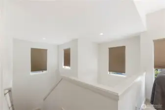 View from upstairs loft looking down the staircase. Blinds are remotely operated.