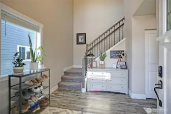 Big foyer, upgraded wide-trim, plank flooring...