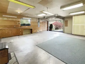 Huge garage leading up to large attic area.