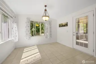 Dining nook with entrance to deck