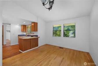 The dining room has hardwood maple flooring.  Your dining table will fit and is ready for entertaining and many meals to come.