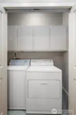 Your washer and dryer are neatly tucked away with - you guessed it - MORE storage.