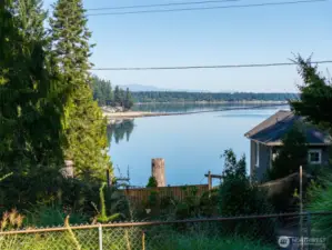 Longing for a charming, mid-century, one-story with a bit of Eld Inlet View, a 2 car shop, lower 1 car garage, a double lot with level RV parking all in Olympia Schools, and close to shopping, waterfront parks, more? Look here!