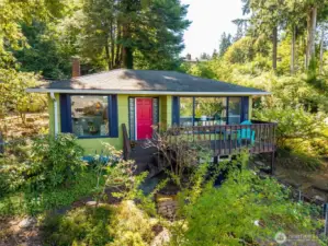 Loads of character abound in this 1945 year built, 1912s/f, 3bdrm/1.75 bath one-story with basement /single car garage and extra hobby/storage area.  all easily accessed from the upper shop/parking area.