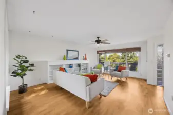 Large picture windows bring the outdoors in while the generous space leaves options for cozy evening, or big screen movie fun.  Put your ideas to work in this flexible living room.