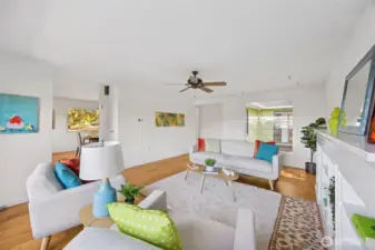 Art walls galore abound in this artisan-friendly space ready for many varieties of decor.  Enter the dining area that flows through to the kitchen from this easy flow, circular floor pattern reflective of mid-century living.