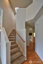 Stairs up to landing and four bedrooms