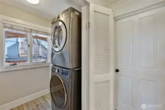 Main floor laundry room with utility sink.