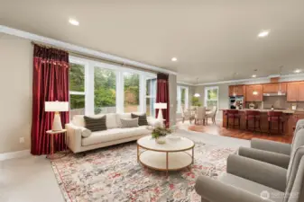 livingroom dining and kitchen overlook the private backyard