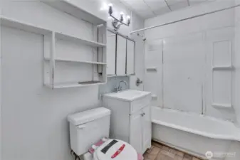 Full bathroom with tub/shower combo.