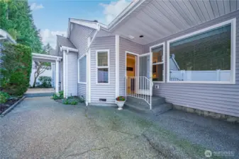 The covered breezeway on the left leads to the oversized two-car garage.