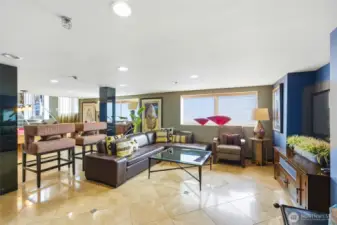 Unwind in the resident lounge featuring a game area and large screen TV.