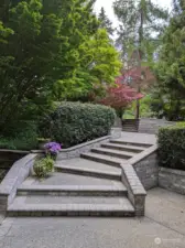 Descend up the stairs to enjoy your beautiful front yard.