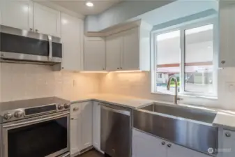 Quartz countertops and accent lighting under cabinets