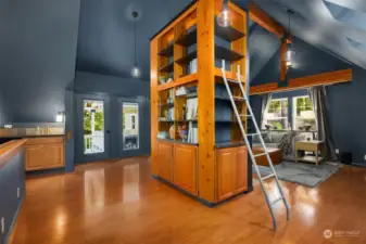 Wet bar, vaulted ceilings and built in cabinets with bookshelves.
