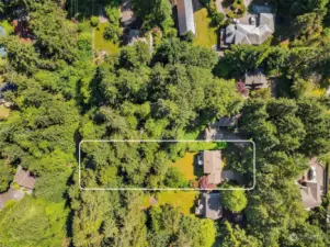 The cleared portion of the property is fully fenced with a gate to the wooded back of the lot that offers a feeling of privacy and seclusion.