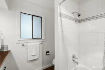 The tub/shower combination allows for either a quick shower or long soak in a bubblebath for a more luxurious experience.