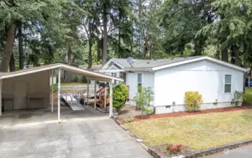 Large storage room two covered carports with plenty of driveway parking!