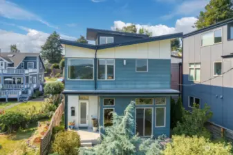 Sited off the street for maximum privacy and expansive views from every window, welcome to this sophisticated Seward Park modern home.