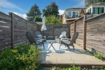 Multiple patios, this one in the back, and balconies take advantage of every inch of this special view property.