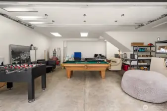 Car enthusiasts and outdoor adventurers will be thrilled by the 10-car garage space, complete with RV parking and ample space for all your recreational gear. Whether you collect cars, boats, or simply need a place for your projects and storage, you have room for everything!  This is one of the three garages below the ADU. Endless opportunities for play, storage or cars!