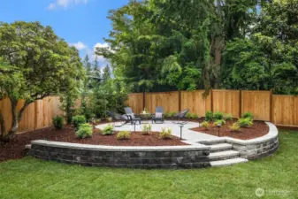 Raised "Oasis" with stacked walls and pavers underfoot