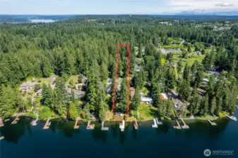 Great view of the 1.85 acres.  Imagine having a 1,000 ft long meandering, paved, driveway through the forest.  Feels like you're on your way to a retreat in the woods when you come home.  On the other side (north) of 20th, about a block to the east, is an entrance to Big Rock Park...features walking trails, gardens, a tree house and more.