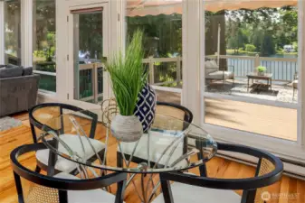 Dining area with a view of the deck and Pine Lake.