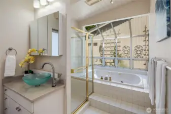 Primary ensuite bath with jetted soaking tub, and separate shower.