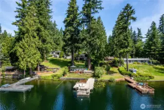 View from the lake looking back at the "shade garden".   The Shade Garden has been a gathering place for the owners, their guests and family for generations.