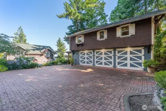 Three-car garage with carriage doors.
