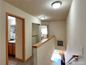 Upstairs landing, toward primary suite and one bath