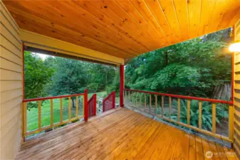 Step outside from the dining area onto the covered deck—ideal for BBQs, outdoor dining, or simply relaxing year-round.