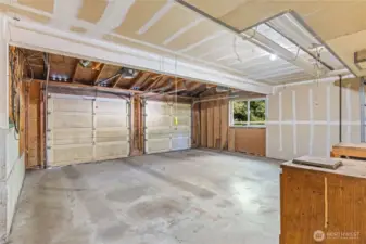Attached oversized two-car garage offers secure parking plus extra room for storage, hobbies, or workspace—convenience right off the main home.