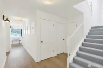 Stairs leading up to family room and primary suite.