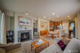 An open floor plan allows friends or family members to comfortably gather during get togethers, whether they want to sit in the living room, the dining area, at the kitchen island or retreat to rec room/tv room pictured in the back right hand corner.
