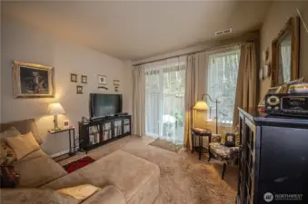 The rec room is your retreat in the evening where you can watch your favorite show or read a good book. The slider leads to a lovely, fenced private backyard.