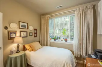 Serene views of wooded backyard make this a welcoming space. And if you make this your guest bedroom, the 3/4 bathroom located right next to it, makes this even more convenient and pleasant for your guests.