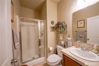 The 3/4 guest bathroom is located right next to the downstairs bedroom.