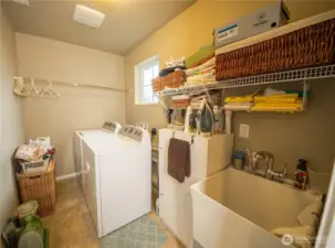 The laundry room is large and includes a laundry sink. Many homes these days don't include a laundry sink and what a pity that is because it is so useful! Kids come home with muddy clothes...throw them in the laundry sink(the clothes, not the kids). Stinky gym clothes...into the laundry sink they go. Little dog need a bath...no problem. This sink is really a useful, versatile feature.