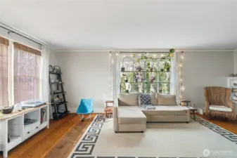 Living room with windows that look out to the city